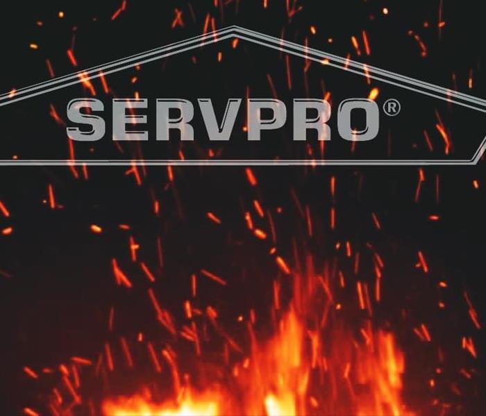 Night sky with sparks from fire. SERVPRO label displayed across sparks.