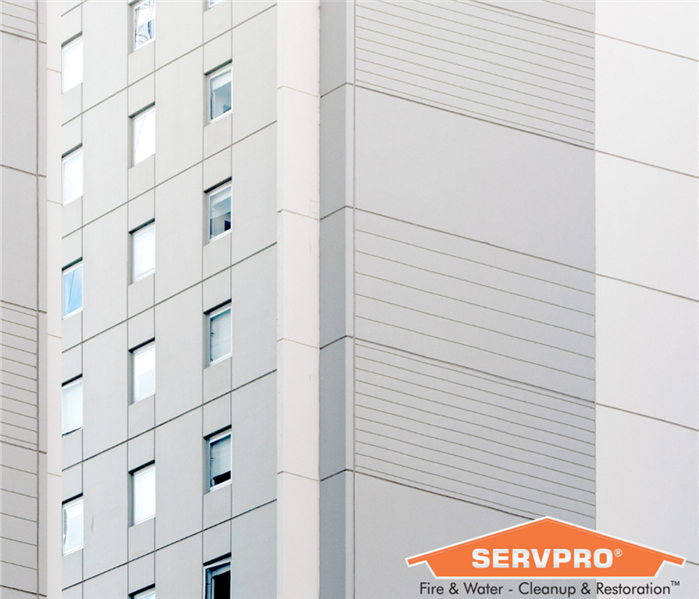 SERVPRO logo on a photo of a tall building 