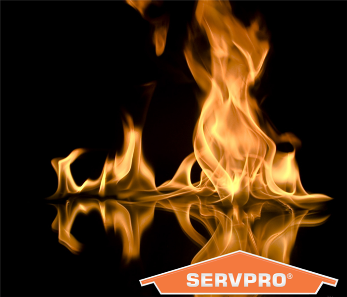 Orange Flames from a fire with SERVPRO house label