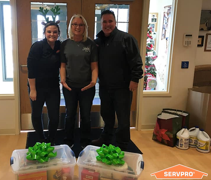 SERVPRO employees with the director of an animal shelter